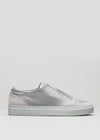 A single white leather low top sneaker with a V17 Grey W/ Green heel detail, displayed against a plain white background.
