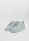 A pair of ML0033 Grey Floater sneakers, handcrafted in Portugal, on a white background.