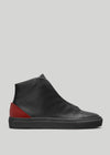 MH00016 by Kennedy high-top sneaker with a red heel accent and thick black sole, displayed against a gray background.