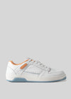 V8 Blue W/ Orange low-top sneaker with perforated detailing, orange accents, and a thick blue sole, displayed against a light grey background.