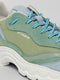 Close-up of a light blue and green low top sneaker with DIVERGE X BUREL Mint printed on the side, showcasing textured fabric and contrast laces.