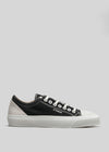 V2 Full Color Black custom low-top canvas sneaker against a light gray background.