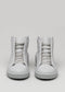 A pair of V7 Grey Floater high-top, light gray leather sneakers with laces, set against a plain gray background.