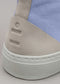 Close-up of a TH0003 by Eduarda showing a textured heel counter with embossed lines and a chunky white sole.