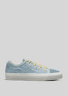 A single V5 Sky & Sage Green low top sneaker with white soles and yellow laces, shown in profile view against a gray background.