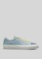 A single V5 Sky & Sage Green low top sneaker with white soles and yellow laces, shown in profile view against a gray background.