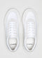 A pair of Start with a White Canvas low-top sneakers with laces, viewed from above on a gray background.