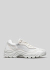 A Start with a White Canvas sneaker with a chunky sole, displayed against a plain gray background.