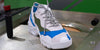 Low top blue, green, grey and white sneakers by Diverge, promoting social impact and custom shoes.