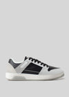 Side view of M0006 by Miteran, handcrafted in Portugal with premium Italian leathers. It features black laces and a white sole, all set against a plain gray background.