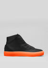 The V48 Black W/ Orange is a high-top sneaker, expertly handcrafted in Portugal from premium Italian leathers, highlighted by a vibrant orange sole. Displayed in side view against a sleek gray background.