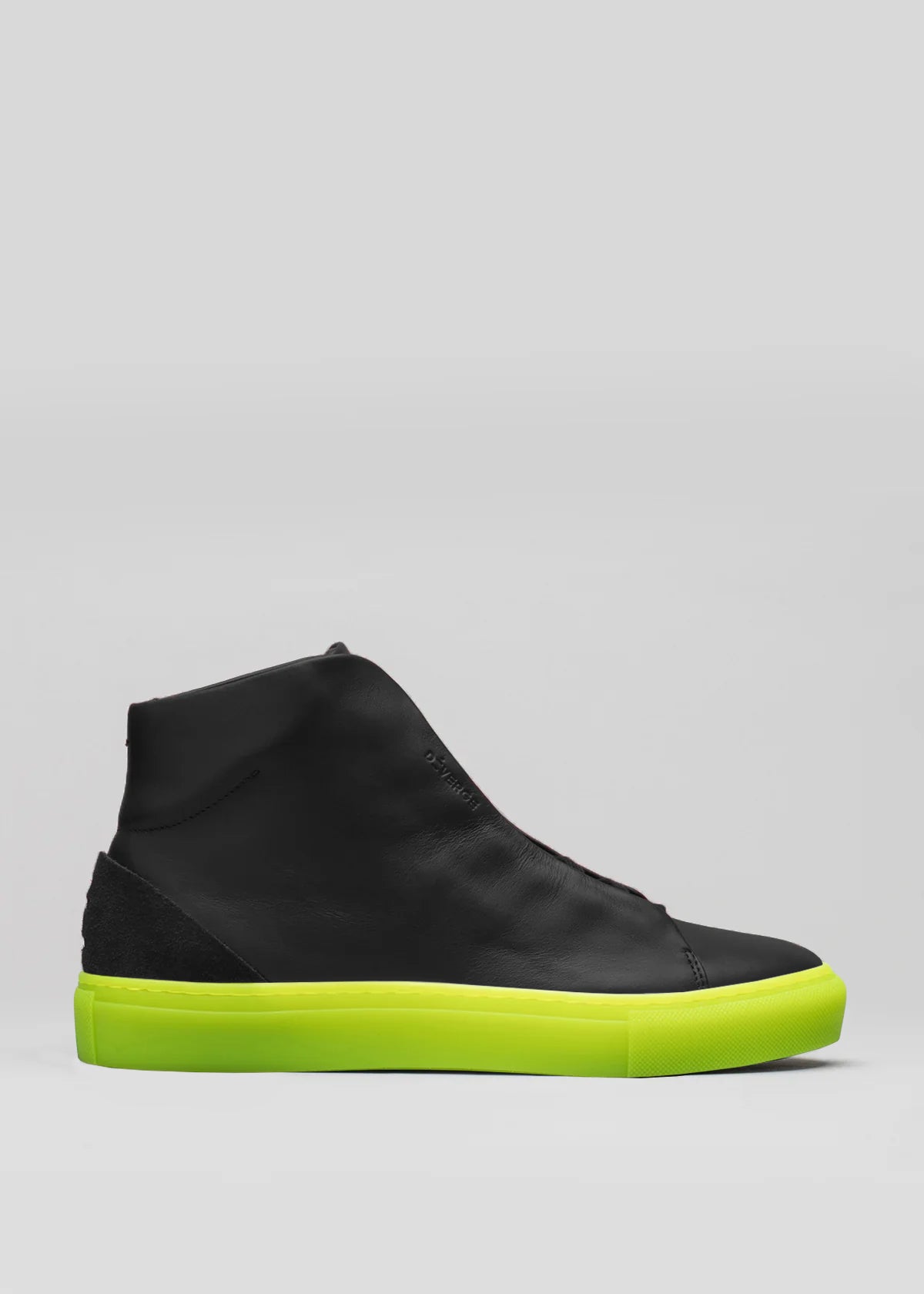 The V51 Black W/ Yellow high-top sneaker, crafted from premium Italian leather, boasts a striking yellow sole on a neutral base. Ethically made, it blends luxury with conscience for modern sneaker enthusiasts.