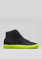 The V51 Black W/ Yellow high-top sneaker, crafted from premium Italian leather, boasts a striking yellow sole on a neutral base. Ethically made, it blends luxury with conscience for modern sneaker enthusiasts.