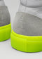 Close-up of V50 Grey W/ Yellow high top sneakers, showcasing gray and white suede with neon yellow rubber soles, handcrafted in Portugal.