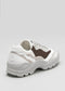 The L0021 by Hanin is a white and gray sneaker with a chunky sole, brown accents, and wavy design elements, made from premium Italian leathers.
