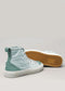 The TH0021 by Luana is a pair of ethically made, handcrafted high-top sneakers in light blue with green accents and white soles, shown from the side and bottom, made in Portugal.