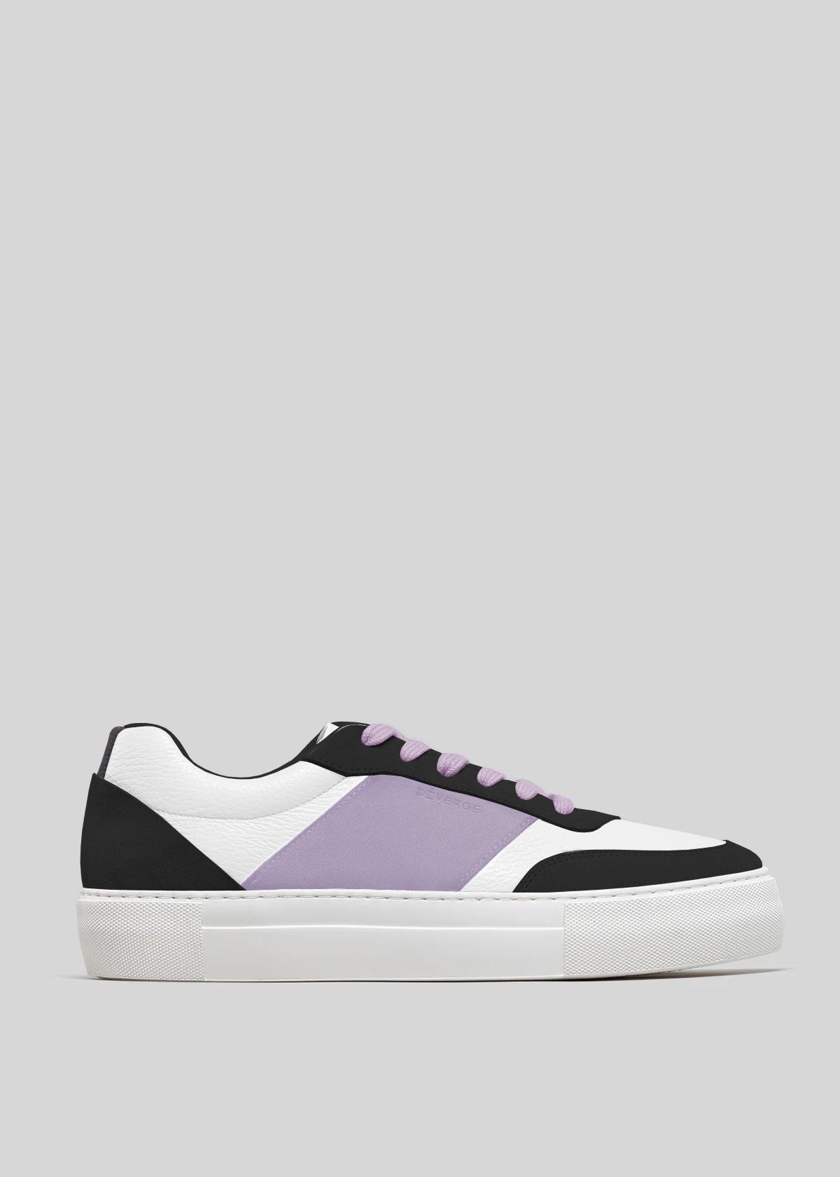 The N0019 by Ana Júlia is a handcrafted low-top sneaker from Portugal, featuring a white sole, black and white panels, and a purple stripe. Made from premium Italian leathers, it includes purple laces and showcases a minimalist design on a gray background.