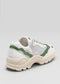 Side view of a white and green V21 Leather Color Mix Forest Green sneaker with chunky soles displayed against a light gray background.