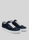 The V3 Marine sneakers, featuring navy blue canvas with white laces and rubber cupsoles, are handcrafted in Portugal and shown against a plain gray background.