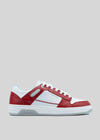 The M0021 by Rafael is a white and red low-top sneaker with a white sole, featuring red panels on the toe, heel, and sides. Handcrafted in Portugal from premium Italian leather, it includes white laces and perforation details for a retro-future look.