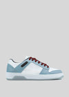 The M0025 by Tatiana is a retro-future sneaker handcrafted in Portugal, featuring white and light blue Italian leathers, dark red laces, black accents, and a textured sole. It's set against a gray background for a stylish look.
