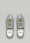 Un par de V17 Grey W/ Green slip-on sneakers, vistas desde arriba sobre un fondo gris claro.