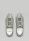 Un paio di slip-on V17 Grey W/ Green sneakers, viste dall'alto su uno sfondo grigio chiaro.