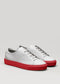 gris y rojo cuero premium bajo sneakers en diseño limpio frontview