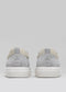 beige and green premium leather pair of sneakers in contemporary design backview
