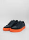 A pair of SO0016 Black W/ Orange shoes on a white background.