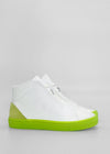 A pair of MH0088 White Leather W/ Lime with bright green soles and light green accents on the heel, crafted from premium Italian leathers, against a gray background.