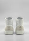 A pair of MH0118 White Leather W/ Bone high-top sneakers, handcrafted in Portugal from premium Italian leathers and featuring a grey heel tab, shown from the back against a plain grey background.