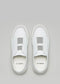 Top view of the V20 White W/ Bone slip-on sneakers, handcrafted and ethically made from premium Italian leathers, set against a gray background.