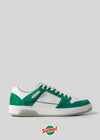 Green and white low-top sneaker with "Sumol 70" branding on the heel, set against a light gray background. Handcrafted in Portugal from premium Italian leathers, the Sumol 70 logo is also placed at the bottom of the image.