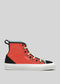 The TH0023 by Erica is a red high-top sneaker with black and teal accents, white sole, beige laces, and a pull tab. Handcrafted in Portugal, this ethically made shoe features "D'VERGE" on the side.