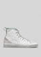 The TH0025 by Nicole is a white high-top sneaker, handcrafted in Portugal. It features light green accents, silver eyelets, and a white rubber sole set against a gray background.