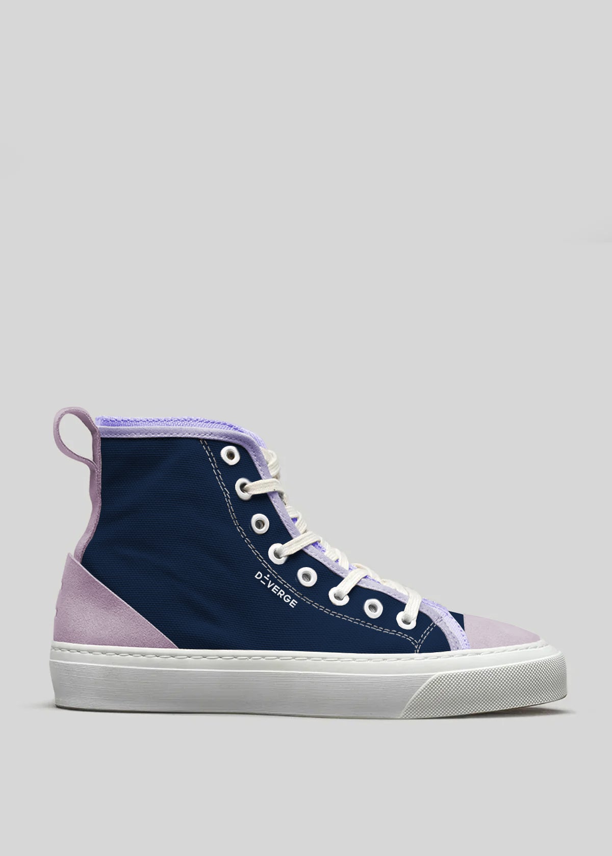 The TH0027 by Stella is a high-top sneaker in purple and blue, featuring a white sole and laces. It's meticulously handcrafted in Portugal from premium canvas.