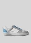 The V11 Grey W/ Blue is a handcrafted low-top sneaker made in Portugal, featuring blue accents with premium Italian leather. It includes perforated side details, a retro-future style, and blue touches on the heel and laces.