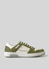 The V12 Olive W/ Off White is a white and green sneaker showcasing a sleek design with a white sole. It features perforated side details and is crafted from premium leather for added luxury and elegance.