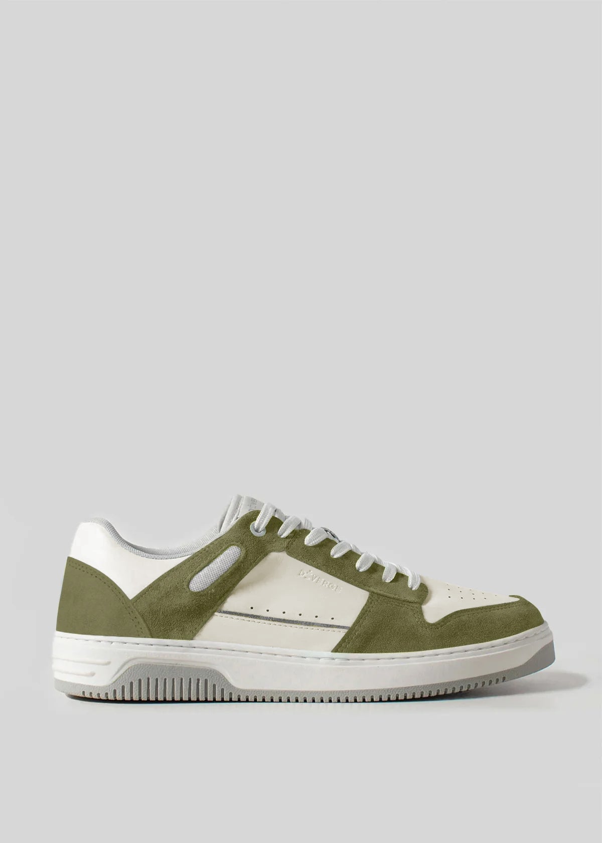 The V12 Olive W/ Off White is a white and green sneaker showcasing a sleek design with a white sole. It features perforated side details and is crafted from premium leather for added luxury and elegance.