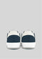 From the back, the V13 Deep Blue W/ Off White sneakers showcase their retro-futuristic design, crafted from premium Italian leathers, set against a gray background.