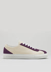 The V16 Beige W/ Plum is a handcrafted Portuguese low-top sneaker featuring premium Italian leathers in cream, highlighted with plum accents and finished with white laces and a sturdy white rubber sole.