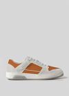 Handcrafted in Portugal, the V16 Saffron W/ Bone is a retro-future low-top with white and brown premium Italian leather panels, a textured sole, and laces set against a light gray background.