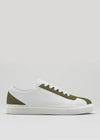 The V17 White W/ Olive sneaker is handcrafted in Portugal from premium Italian leathers, featuring a white low-top design with olive green accents on the toe, heel, and lace area, shown against a plain light background.