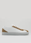 The V18 White W/ Beige is a timeless low-top sneaker handcrafted in Portugal from premium Italian leather, featuring beige accents on the heel, tongue, and sides, white laces, and a light grey rubber sole.