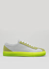 The V20 Grey W/ Lime is a white low-top sneaker with light green accents and a neon yellow sole, handcrafted in Portugal from premium Italian leathers, shown in a side view on a plain background.
