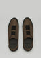 The V26 Brown W/ Black ethical sneakers feature slip-on brown shoes with black elastic bands, white soles, and branded "D:VERGE" insoles. Handcrafted from premium Italian leathers in Portugal, they are elegantly displayed against a light gray background.