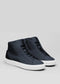 The V46 Blue Floater W/ White is a pair of dark blue high-top sneakers, handcrafted in Portugal from premium Italian leather, featuring white soles on a plain grey background.