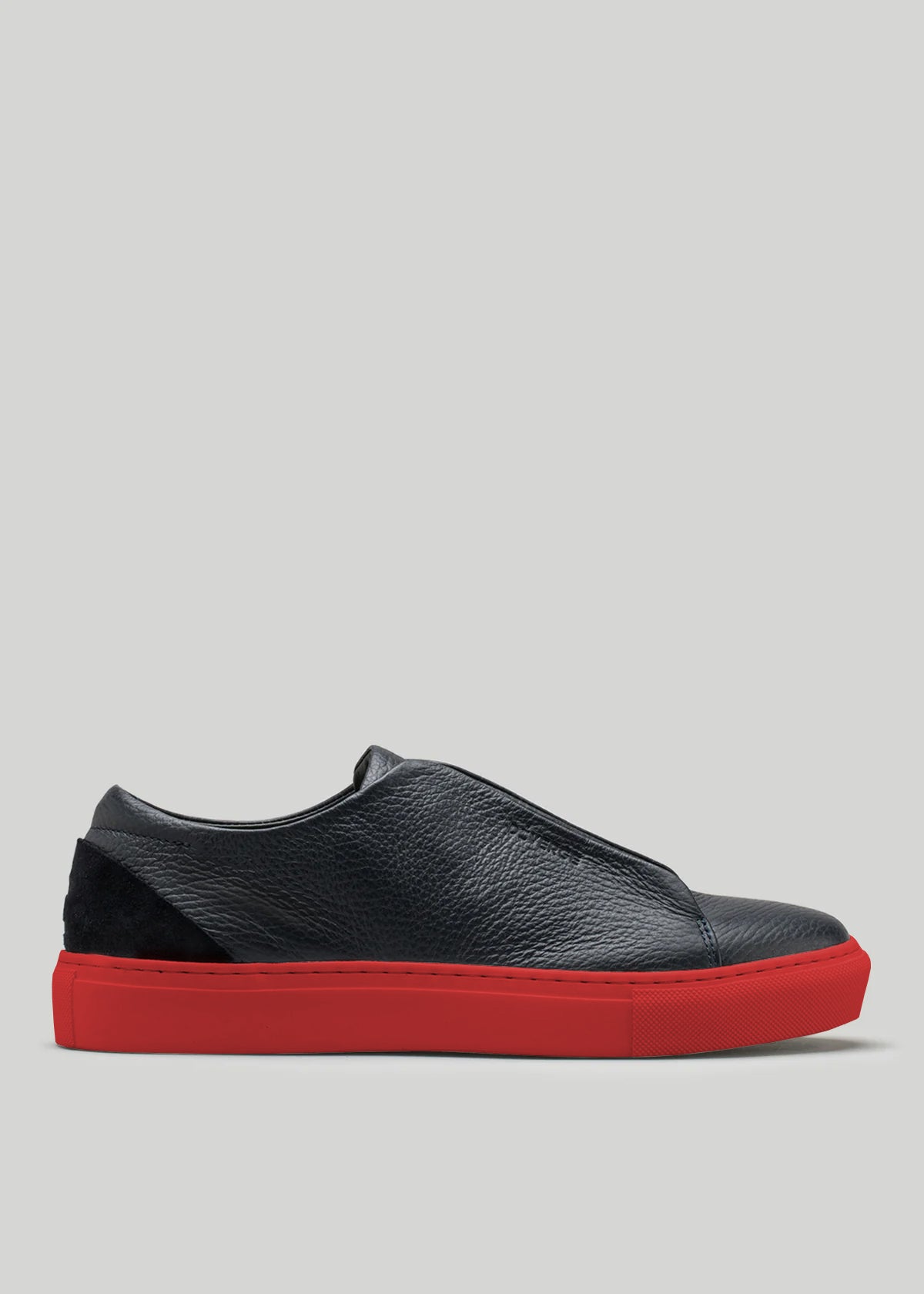 The V48 Deep Blue W/ Red is a premium Italian leather slip-on sneaker in black with red soles, showcased in a side profile against a plain background.
