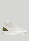 The V52 Off-White W/ Olive is a white mid-top sneaker with smooth leather, featuring an olive green heel panel and a white rubber sole, ethically handcrafted in Portugal for superior quality.